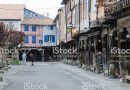 Mirepoix, France - April 8, 2014: Wooden arcaded streets of the French medieval village of Mirepoix.